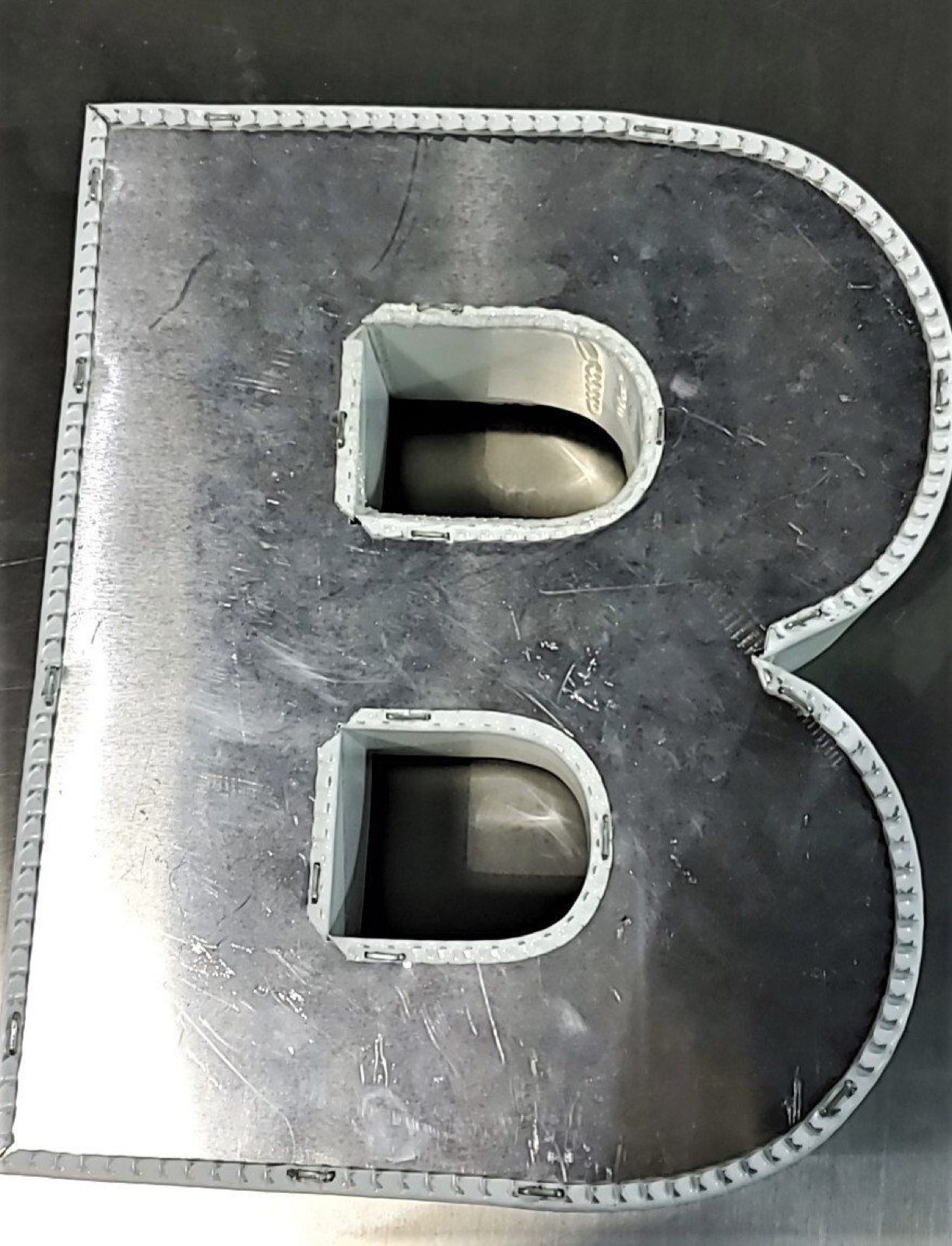Flanging letters made with Ascent-Edge or TMB-3